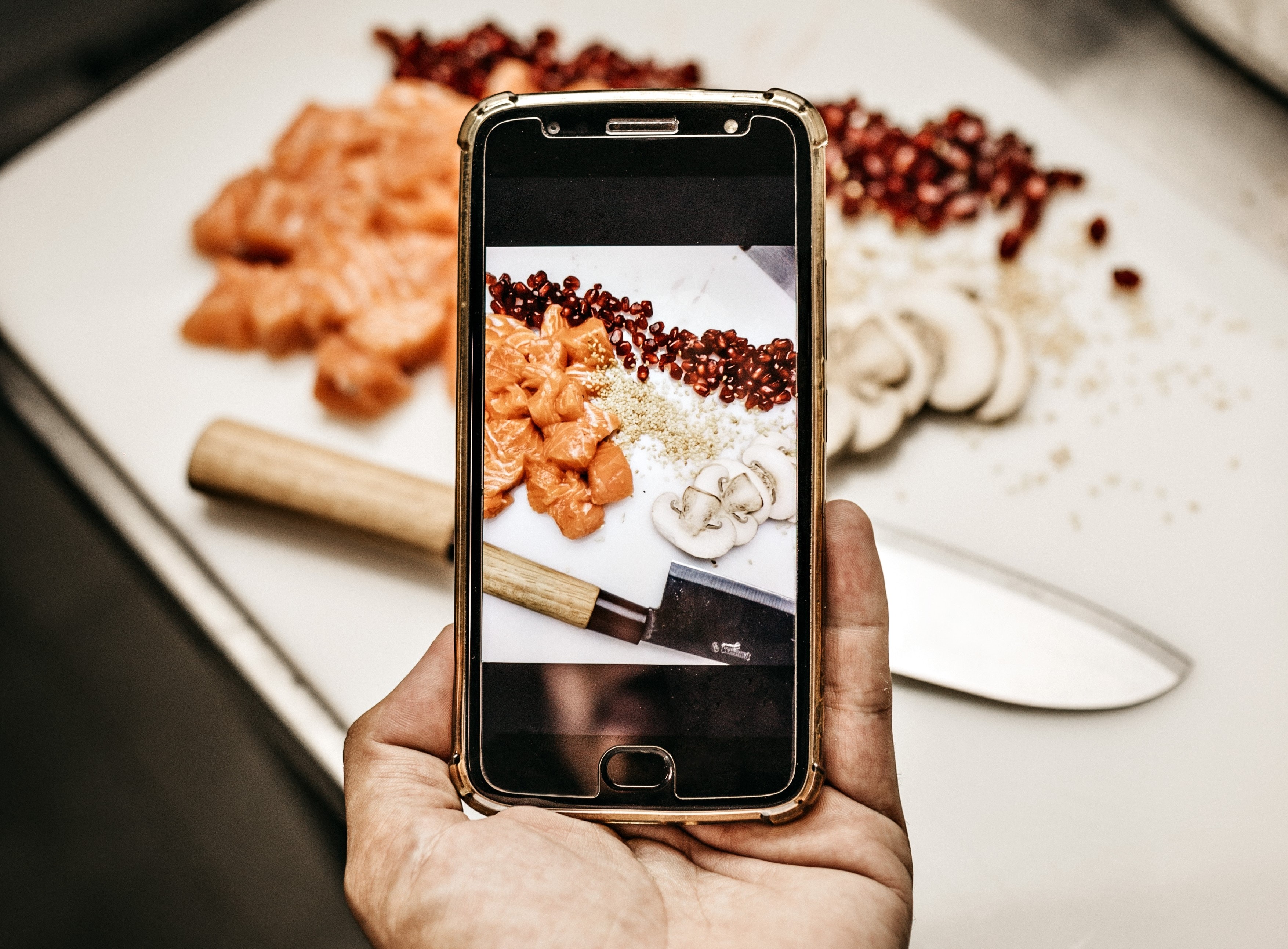 chef taking picture of dish